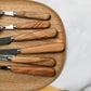 Sabre Paris olive wood bread knife showing the natural wood grain